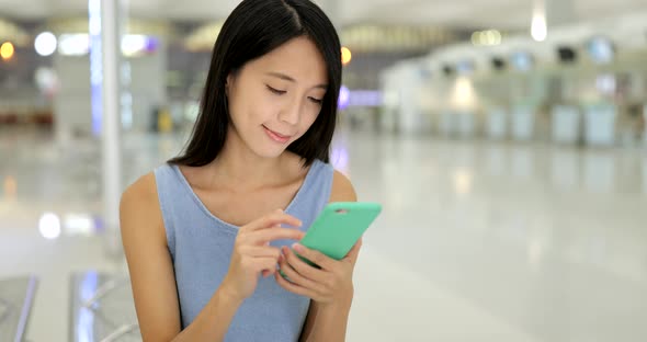 Woman use of cellphone in airport