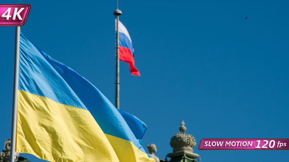 Flags Of Ukraine And Russia Sway The Wind