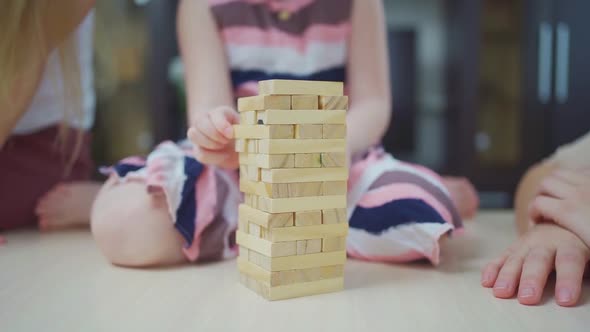 Mom and Daughters Play Blocks