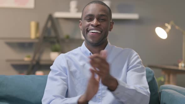 Portrait Shot of Happy African Man Clapping Applauding