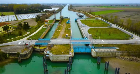 A River Dam with Two Passages for Ships