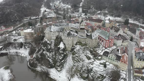 Loket castle and old city, Czech Republic. Aerial view, 12th landmark on winter season, drone shot