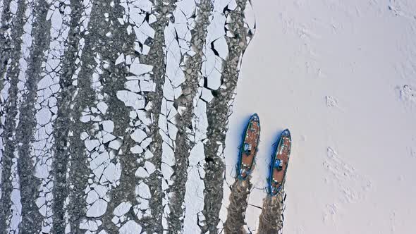 Icebreakers on Vistula river breaking the ice in Poland