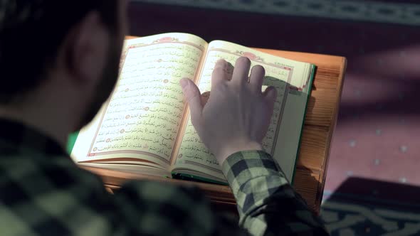 Muslim Young Man Reading Quran Mosque