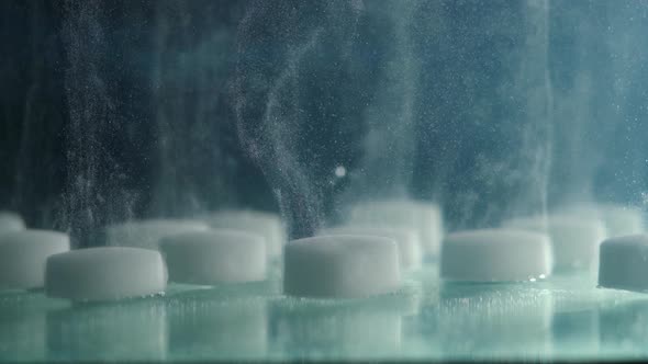 Extreme Closeup of Dissolving a Salt Tablet in Water