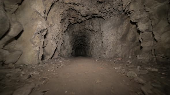 Speleology Artificial Cave Dark Tunnel Excavation Underground. Old Adit for the Extraction of Metal
