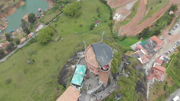 Drone flight over the summit of the Penol in Guatape, Antioquia, Colombia - aerial shot