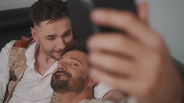 Funny Romantic Male Gay Couple Using Smartphone for Video Call