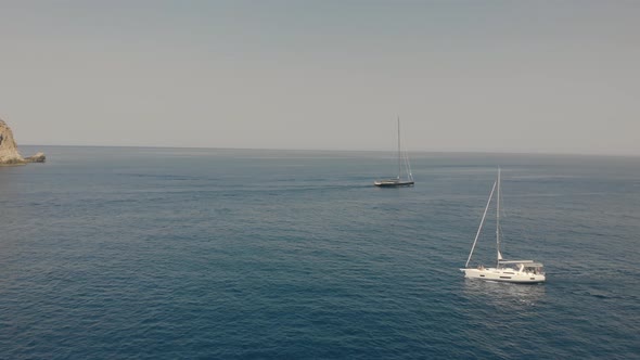 Aerial View of Yachts Near Rocky Island of Mallorca