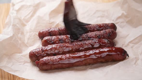 Sausages Fried with Sauce on Parchment Paper