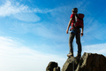 Climber arrive on the summit of a mountain peak. Concepts: victo - PhotoDune Item for Sale