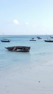 Vertical Video Boats in the Ocean Near the Coast of Zanzibar Tanzania