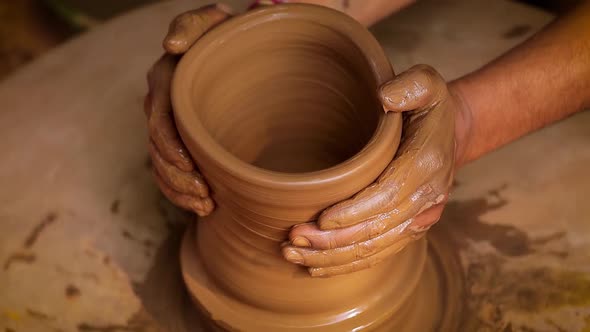 Potter at Work Makes Ceramic Dishes