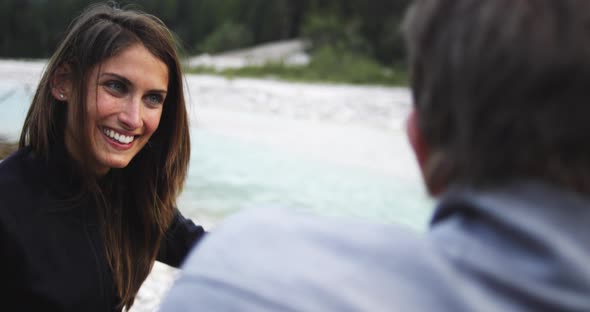 Woman Smiling and Laughing with Man Friend Near River Creek