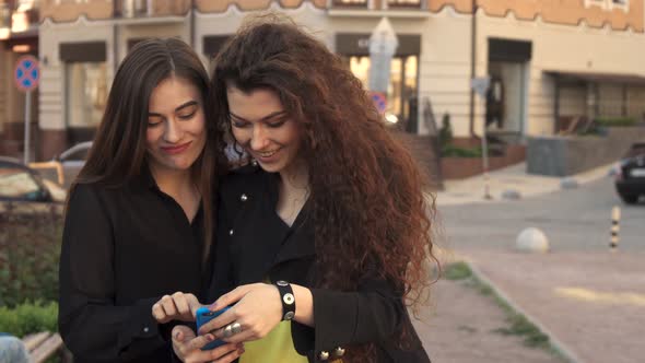 Female Friends Take Selfie Outdoors