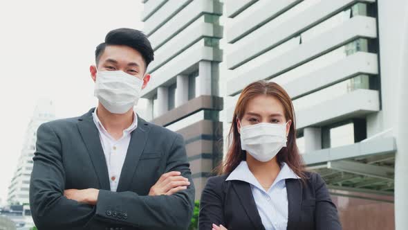 Asian Group of young office business people standing outdoor in city with new normal lifestyles.