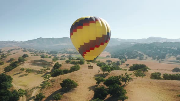 Colorful Hot Air Balloon Flying Over California Landscape  Aerial Footage USA