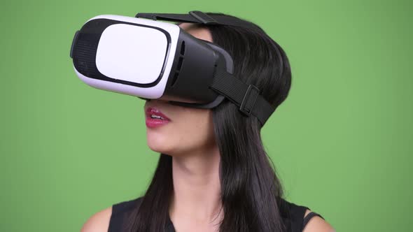 Young Beautiful Asian Businesswoman Using Virtual Reality Headset