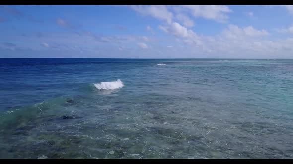 Aerial view tourism of idyllic resort beach break by shallow ocean and white sandy background of a d