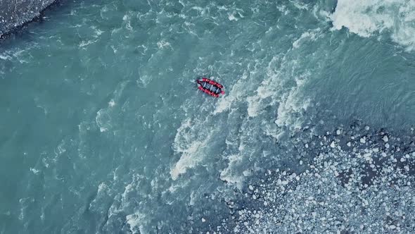 Areial View of Group of People on a Rafting Trip on a Blue River