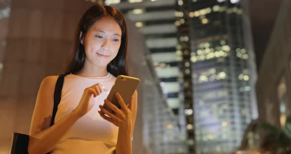 woman using mobile phone in the city