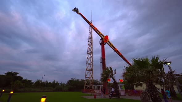 Carousel ride spins fast in air at sunset