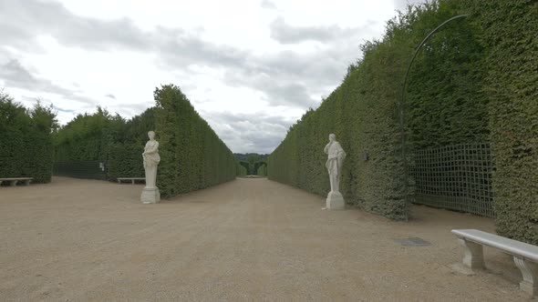 Alleys with statues in the gardens of Versailles