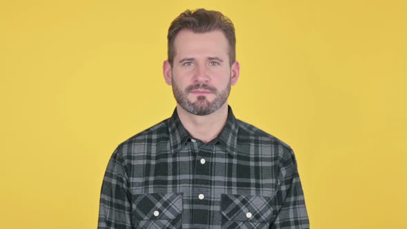 Portrait of Serious Middle Aged Man Looking at the Camera