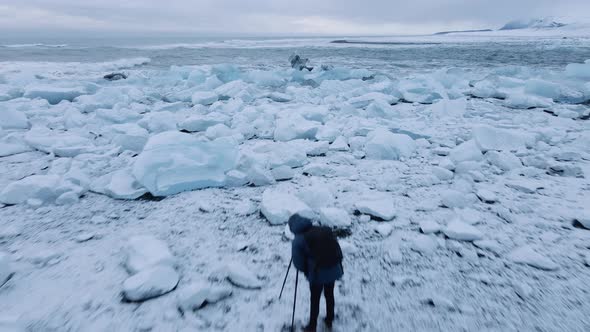 Drone Over Photographer on Diamond Beach Near Glacier Lagoon of Iceland