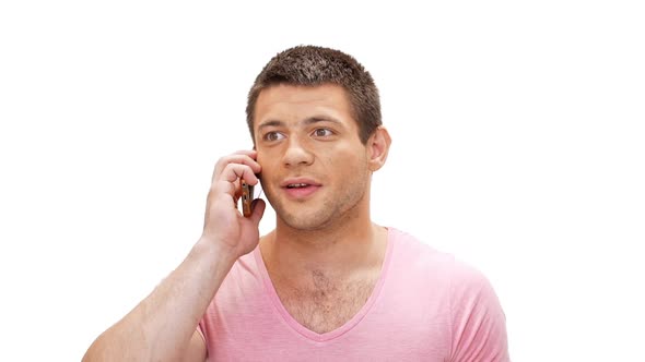 Happy Young Man Talking on Phone Rejoicing Over White Background Slow Motion