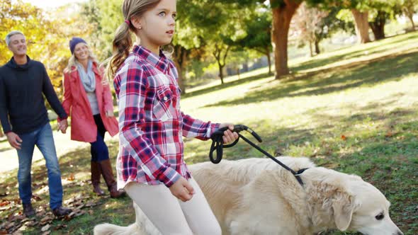 family walking with dog outdoors