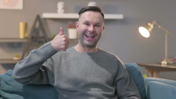 Portrait of Casual Man Showing Thumbs Up Sign