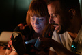 Ginger woman and man with beard looking at a phone and laughing - PhotoDune Item for Sale