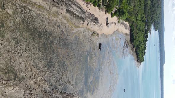 Vertical Video of Low Tide in the Ocean Near the Coast of Zanzibar Tanzania Aerial View