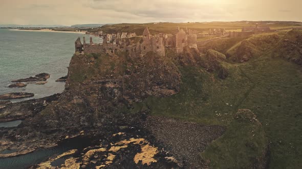 Medieval Dunluce Castle on Cliff Aerial