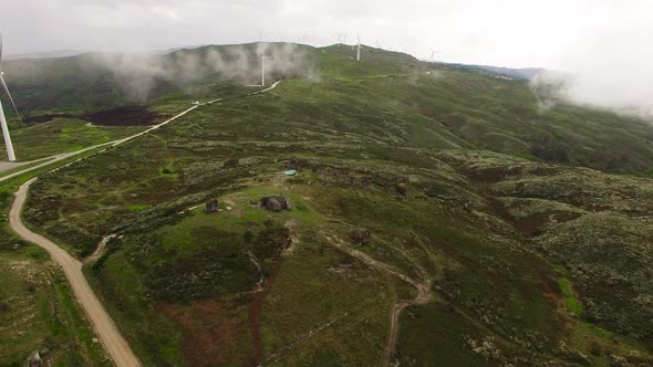 Wind Farm in the Fog at Sunrise