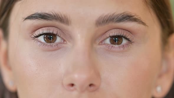 Close Up of Blinking Eyes of Beautiful Young Woman