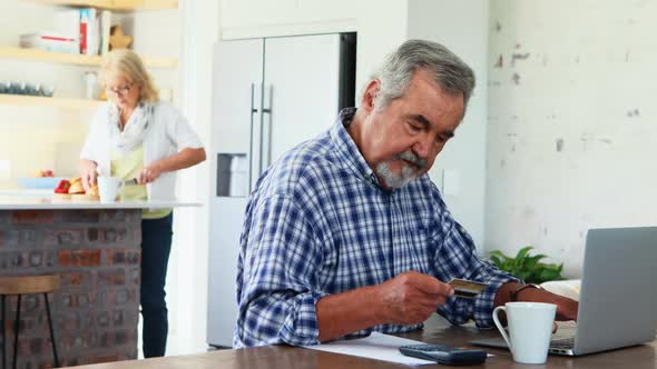 Senior man doing online shopping