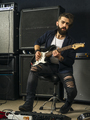 Bearded man playing guitar in a music studio - PhotoDune Item for Sale