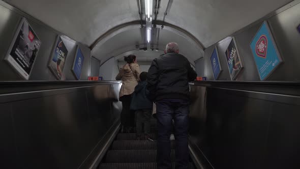 people moving on escalator senior man and family 4k