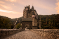 Burg Eltz Castle at sunrise in autumn - PhotoDune Item for Sale