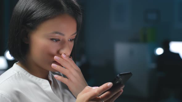 Close Up of AfricanAmerican Businesswoman Receive Bad News on Cellphone