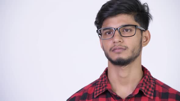 Young Happy Bearded Indian Hipster Man Smiling and Thinking