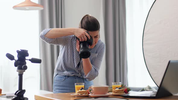 Food Photographer with Camera Working in Kitchen