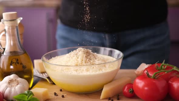 Making Pasta Carbonara Sauce  Adding Salt and Spices Into Glass Bowl