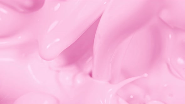 Super Slow Motion Shot of Pouring and Splashing Strawberry Milk at 1000Fps