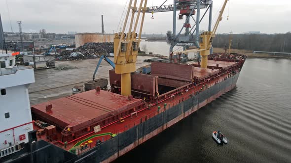 Cargo ship and port cranes