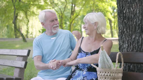 Portrait Joy Mature Couple Sitting on the Bench Admiring Nature