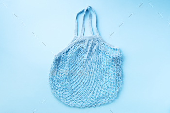 kground. Zero waste, plastic free concept. Top view. Eco friendly mesh shopper. Banner with copy space.