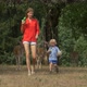 Mother with child in the wildlife park with tame deer - VideoHive Item for Sale